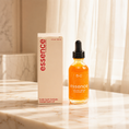 Load image into Gallery viewer, Essence Restorative Body Oil bottle on display, Peach and Cream skincare