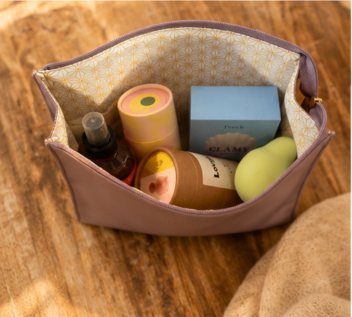 The Kindred Keeper Vegan Leather Storage Bag, shown open with contents